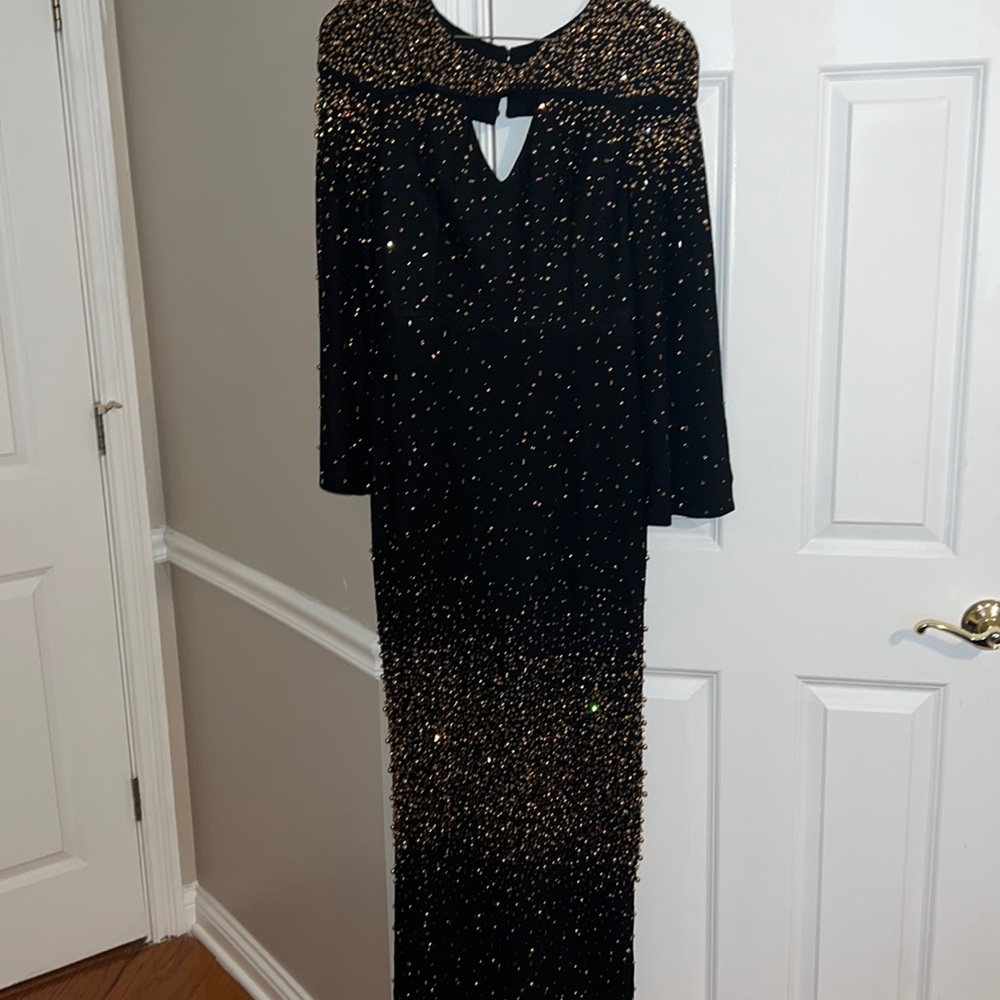 Beautiful, heavily beaded, black and gold and gown with  crystals